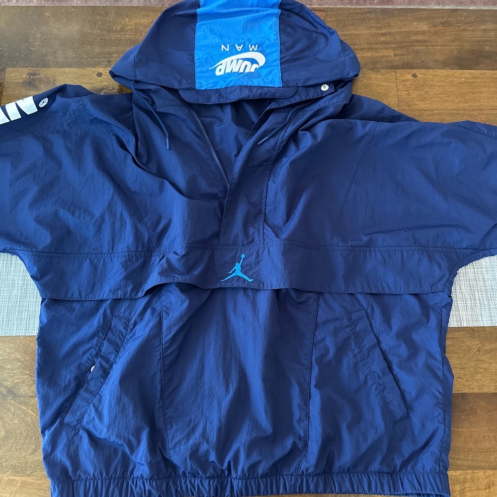 RARE VINTAGE blue jumpman Jordan raincoat.
